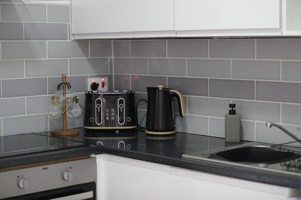 Coffee/tea facilities, Kitchen or kitchenette, Other, Decorative detail, storage, stove, toaster, kitchen