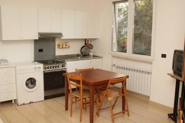 Kitchen or kitchenette, stove, washing machine