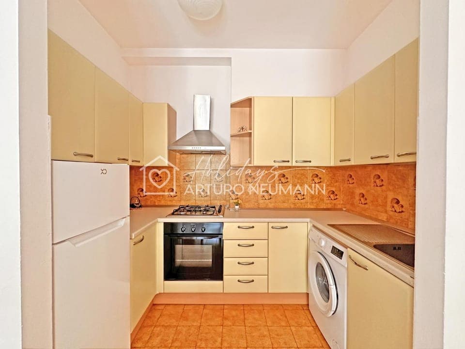 Kitchen or kitchenette, oven, stove, washing machine, kitchen