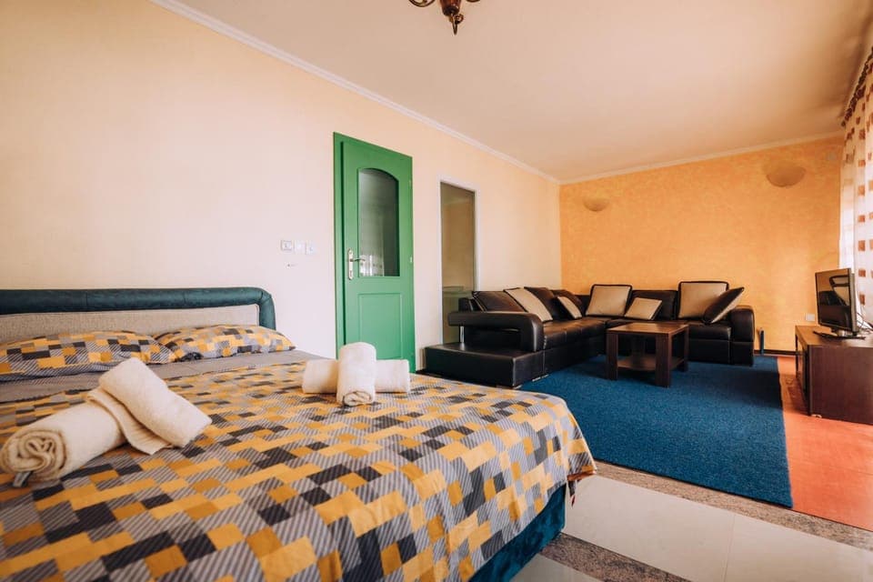 Bed, Living room, Seating area, Bedroom