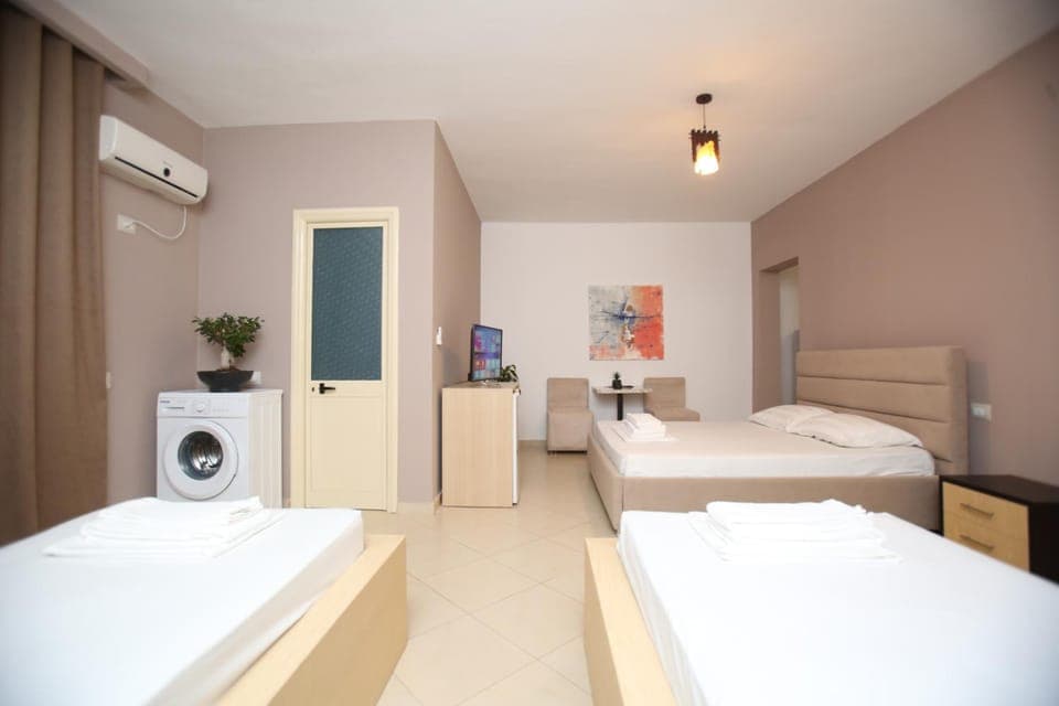 Bed, Photo of the whole room, towels, washing machine, air conditioner