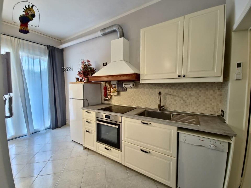 Kitchen or kitchenette, dishwasher, oven, stove