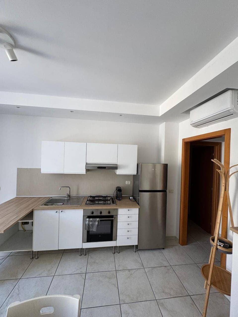 Kitchen or kitchenette, oven, air conditioner