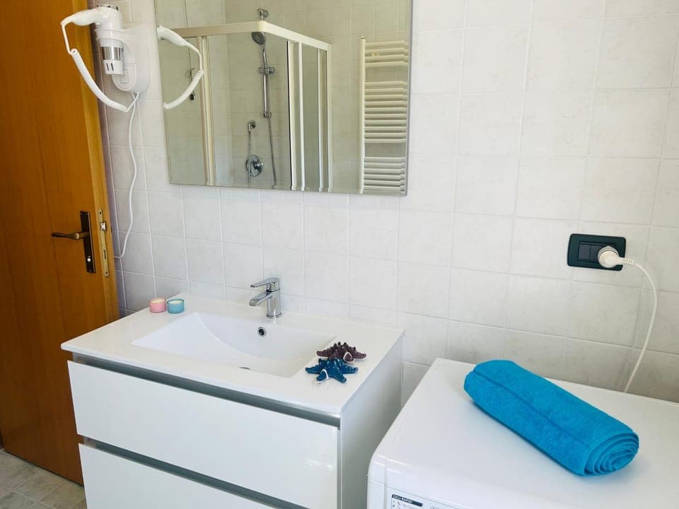 Bathroom, hair dryier, washing machine