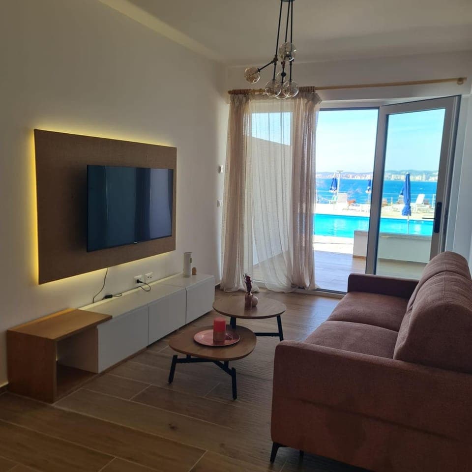 TV and multimedia, Living room, Seating area, Pool view, Swimming pool