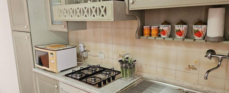 Kitchen or kitchenette, stove, toaster