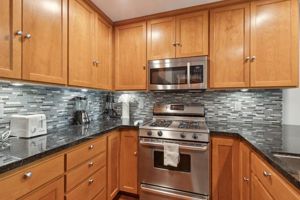 Kitchen or kitchenette, dishwasher, microwave, oven, stove, toaster