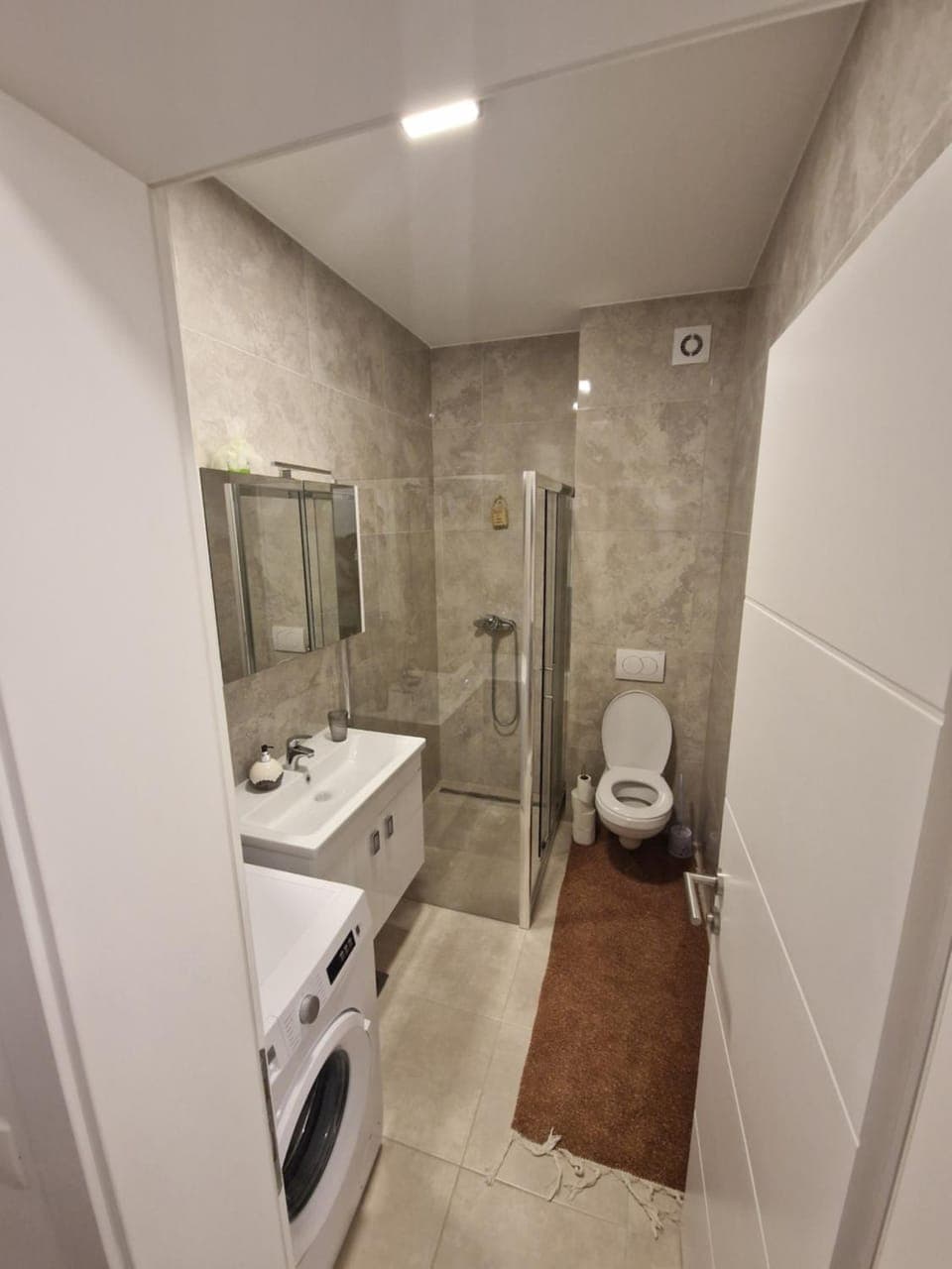 Shower, Toilet, Bathroom, towels, washing machine, dryer