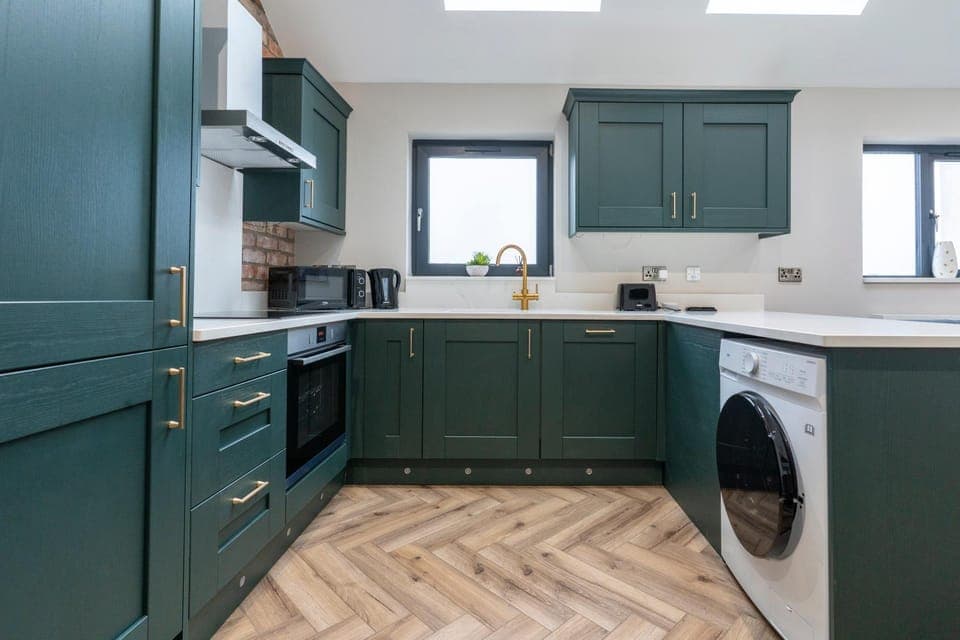 Kitchen or kitchenette, dishwasher, stove, washing machine, dryer