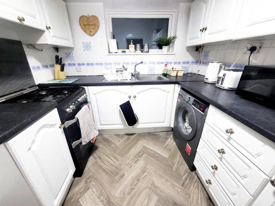 Kitchen or kitchenette, oven, stove, toaster