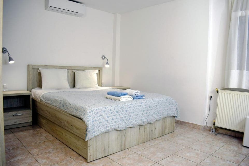 Bed, Photo of the whole room, Bedroom, towels, air conditioner