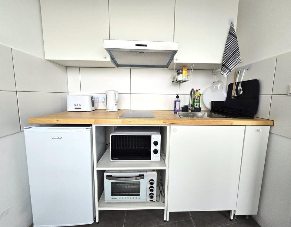 Kitchen or kitchenette, oven, stove, toaster