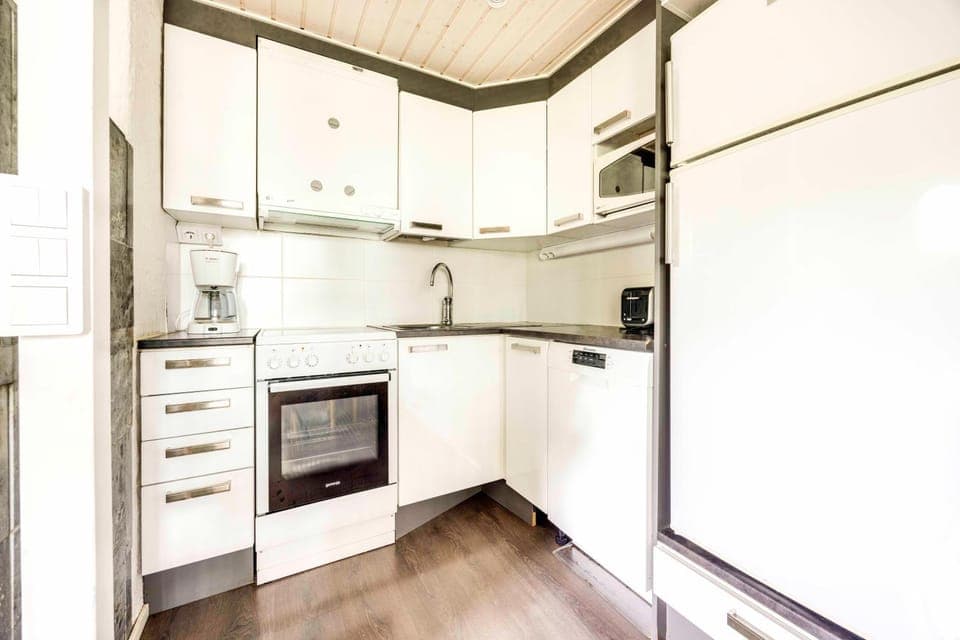 Kitchen or kitchenette, dishwasher, oven, stove, toaster