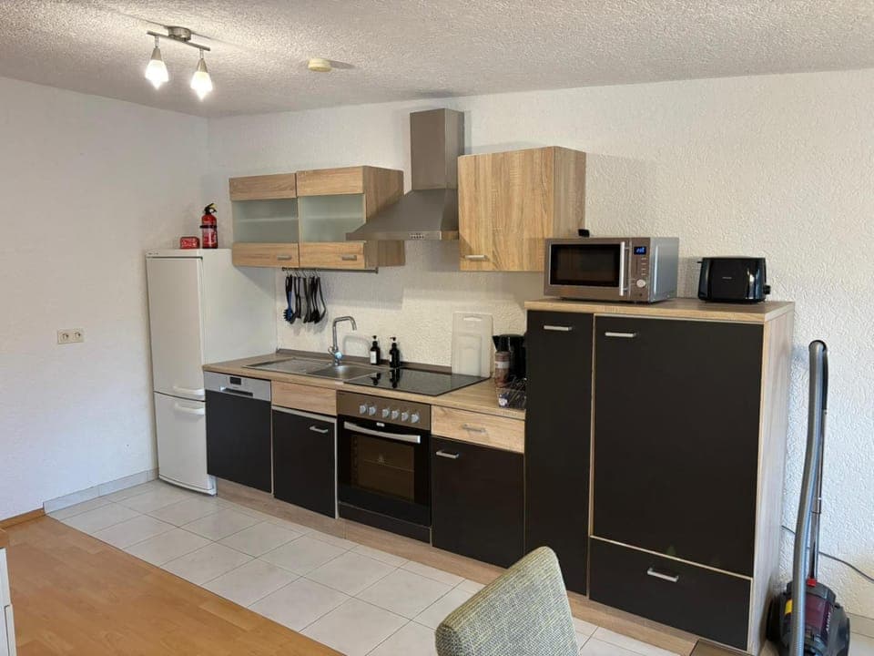 Kitchen or kitchenette, dishwasher, oven, stove, toaster