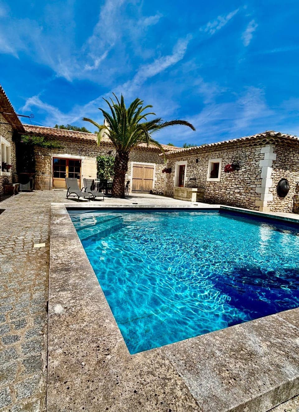 Property building, Patio, Pool view, Swimming pool, sunbed