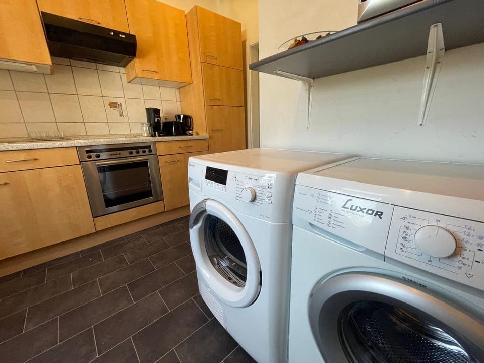 Kitchen or kitchenette, minibar, oven, stove, toaster, washing machine, dryer