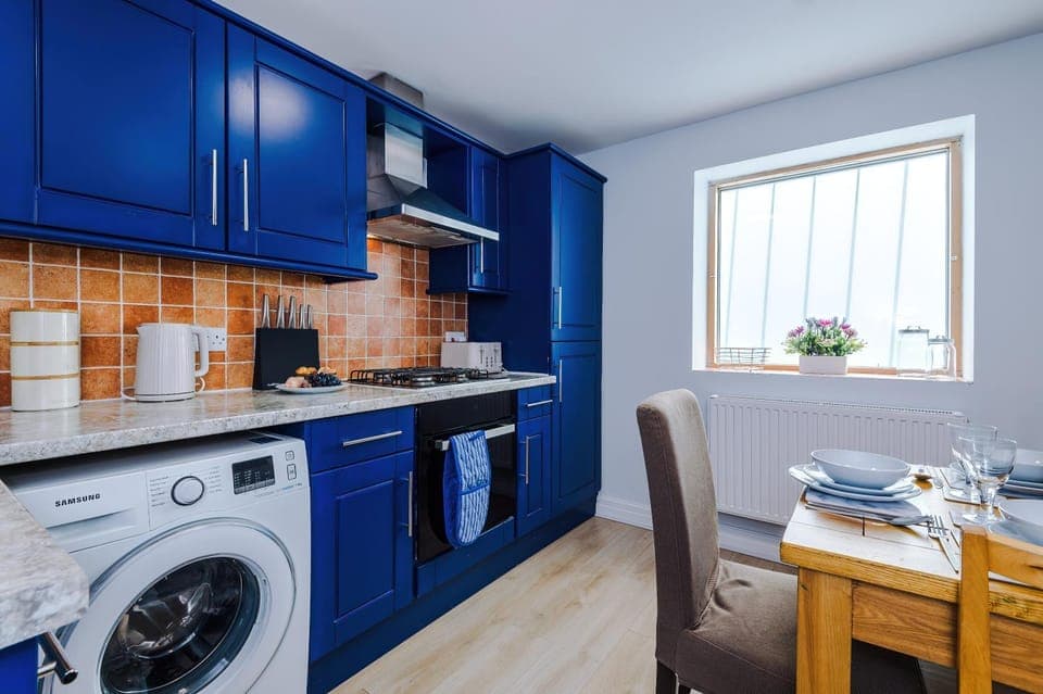 Kitchen or kitchenette, oven, stove, toaster, washing machine