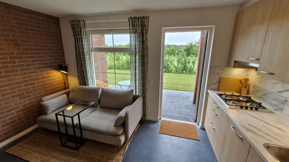 Kitchen or kitchenette, Living room, Seating area, Dining area