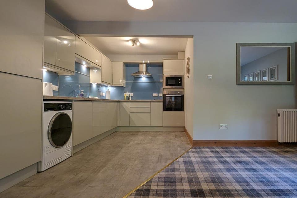 Kitchen or kitchenette, dishwasher, oven, stove, washing machine, dryer