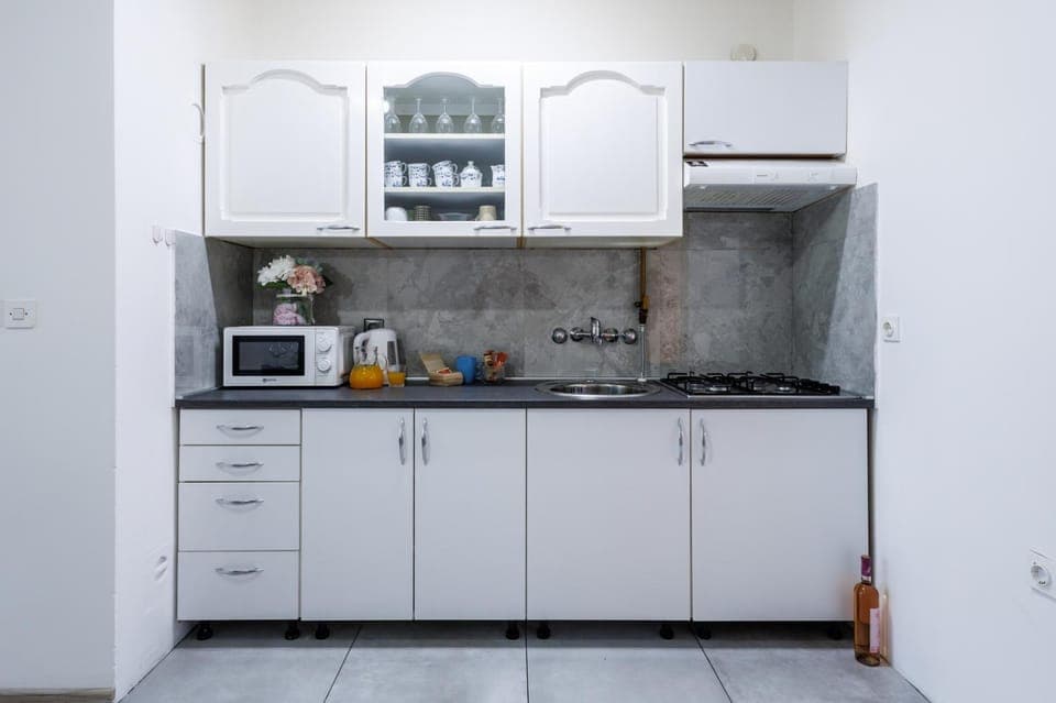 Kitchen or kitchenette, stove, toaster