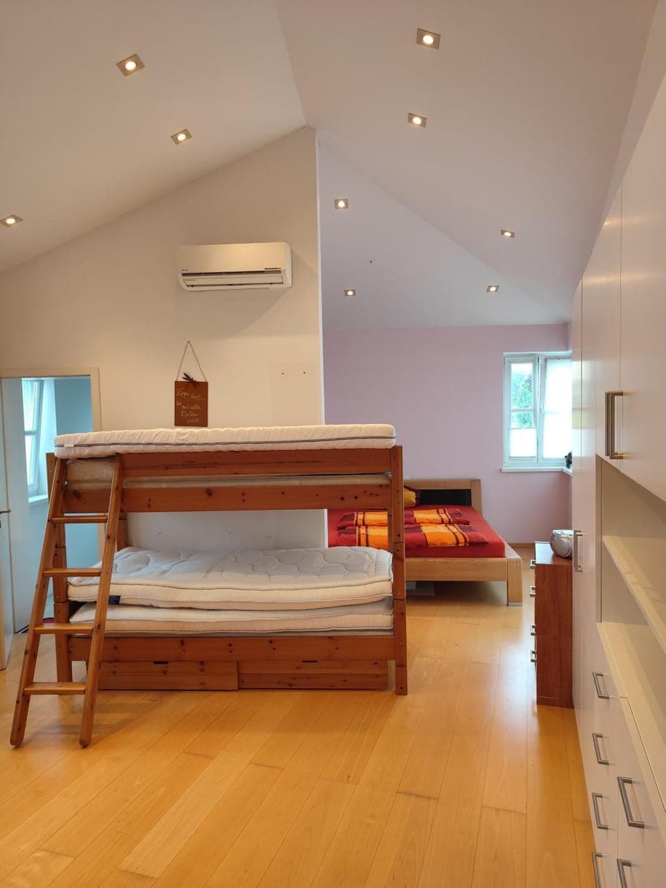 Photo of the whole room, bunk bed, air conditioner