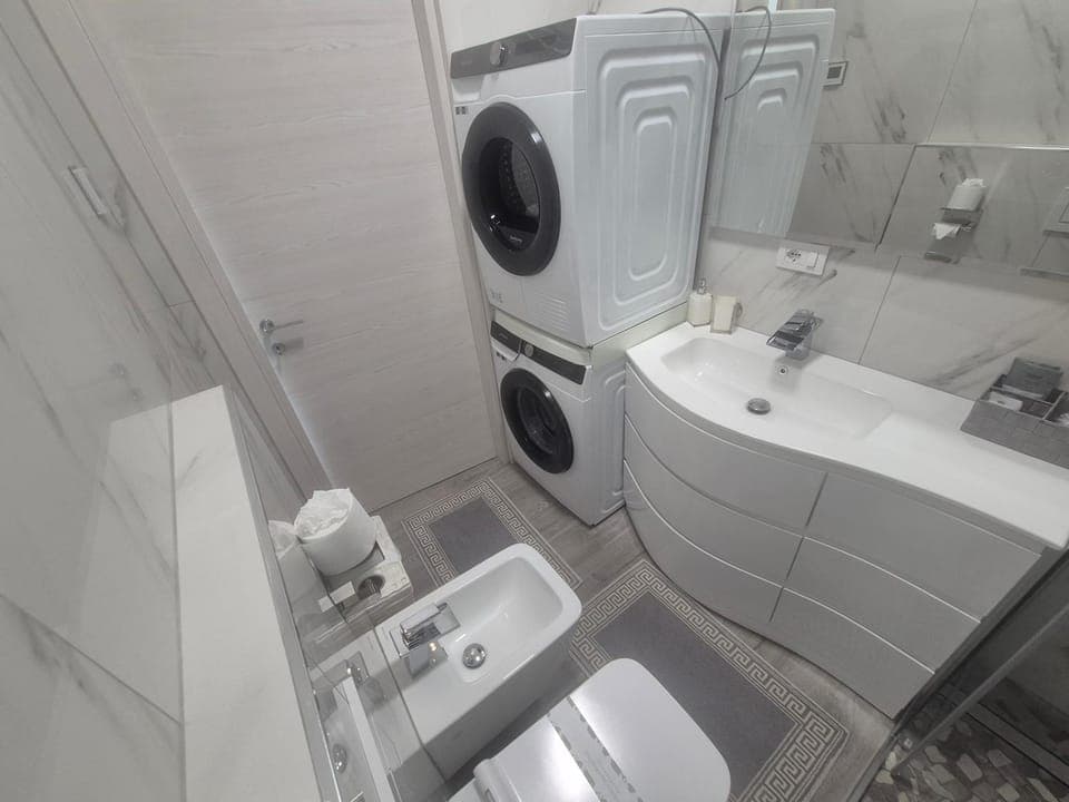 Shower, Toilet, Bathroom, towels, washing machine, dryer