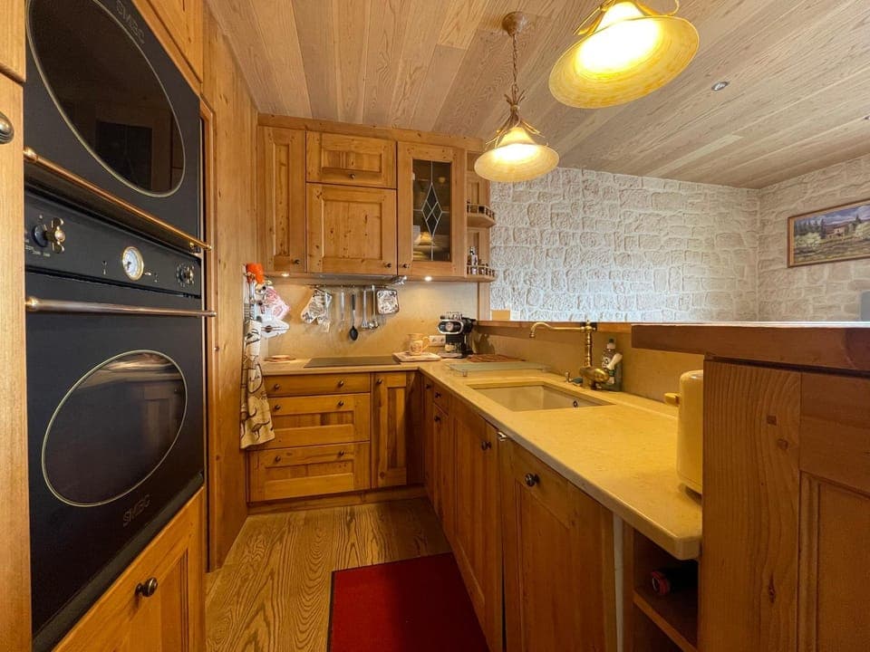 Kitchen or kitchenette, dishwasher, oven, stove