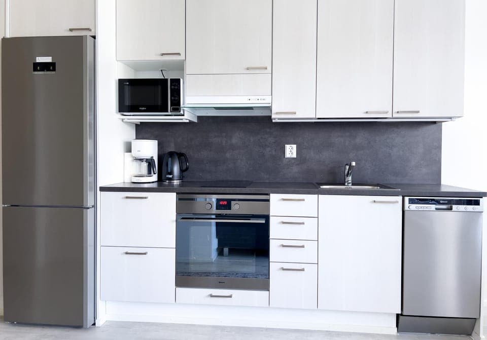 Kitchen or kitchenette, dishwasher, oven, stove, toaster