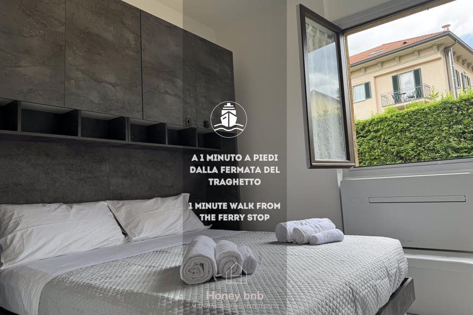 Bed, Photo of the whole room, Bedroom, Text overlay, towels