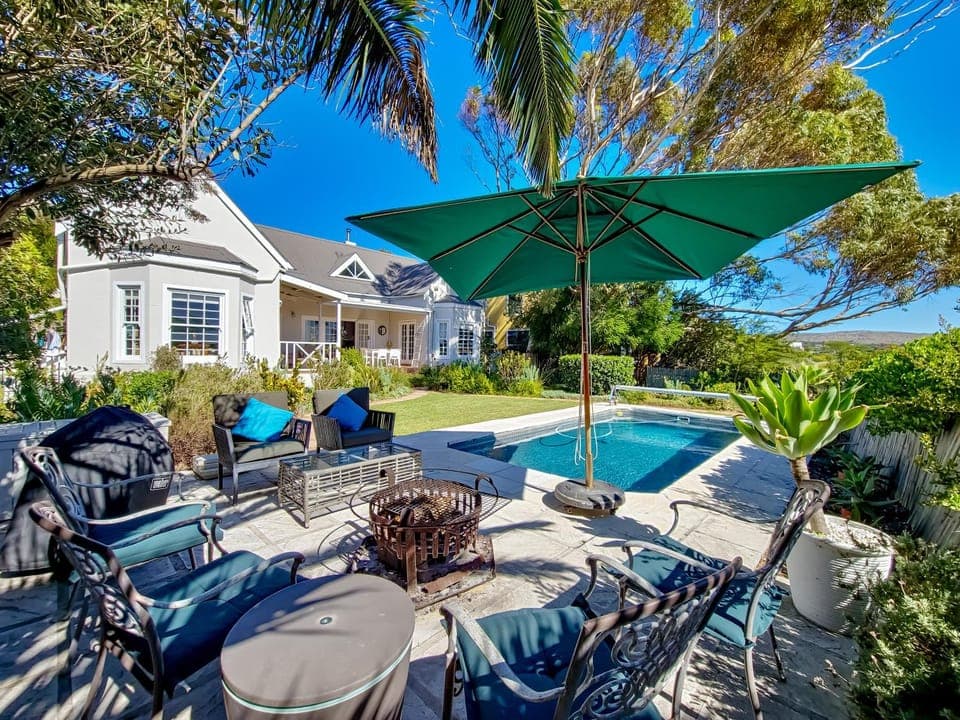 Property building, Patio, Natural landscape, Seating area, Garden view, Pool view, Swimming pool