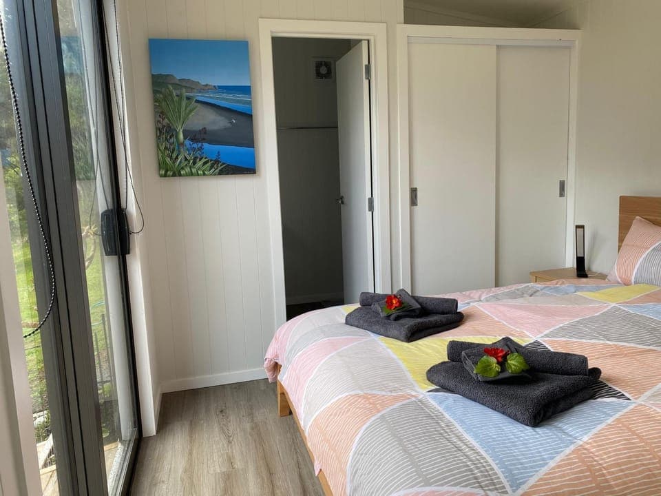 Bed, towels, wardrobe