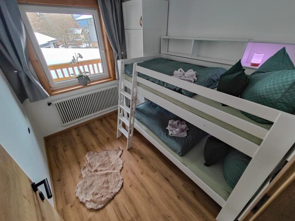Photo of the whole room, children, bunk bed, towels