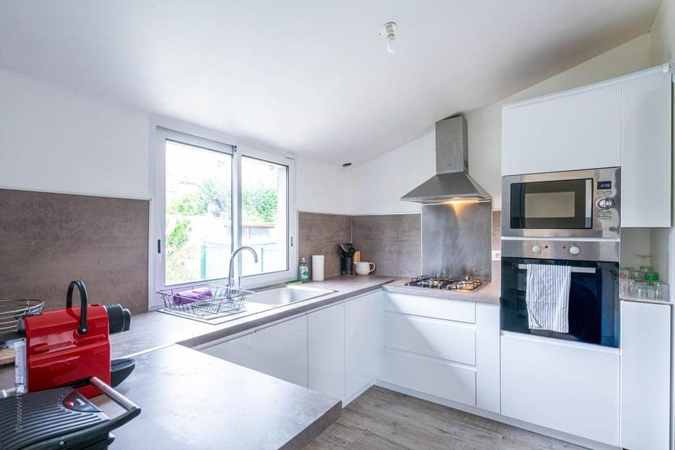 Kitchen or kitchenette, dishwasher, oven, stove, toaster