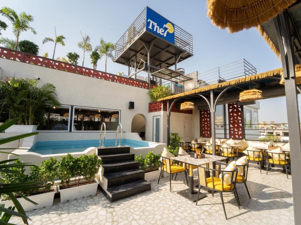 Property building, Patio, Day, Seating area, Pool view