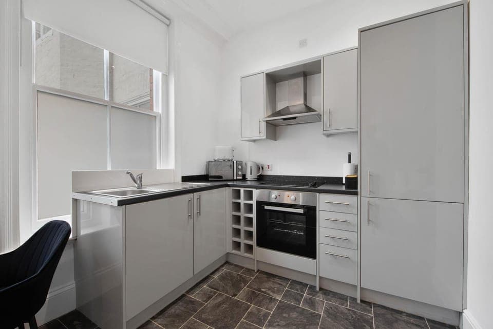 Kitchen or kitchenette, stove, toaster