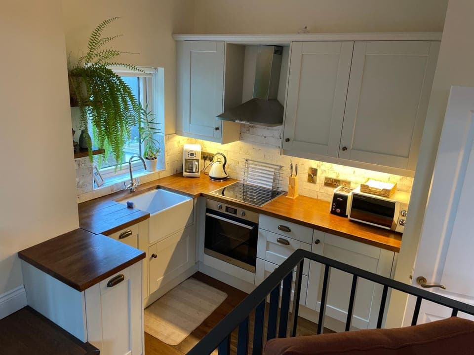 Kitchen or kitchenette, dishwasher, oven, stove, toaster