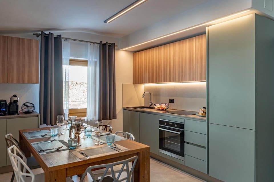 Kitchen or kitchenette, dishwasher, oven, stove