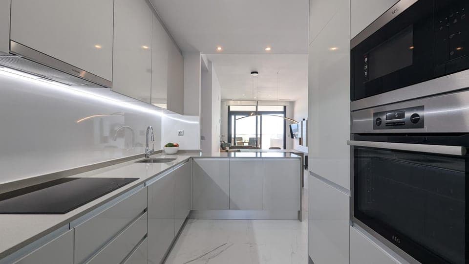 Kitchen or kitchenette, dishwasher, oven, stove