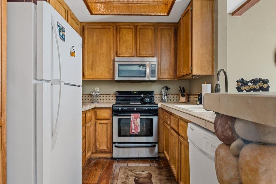 Kitchen or kitchenette, dishwasher, oven, stove, toaster