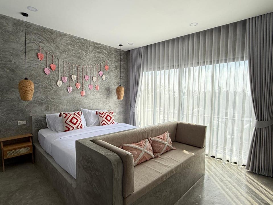 Bed, Living room, Seating area, Bedroom