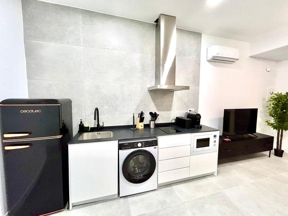 Kitchen or kitchenette, stove, air conditioner