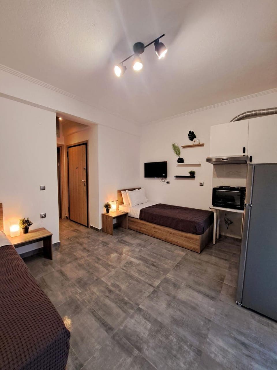 Bed, TV and multimedia, Kitchen or kitchenette, Living room, Photo of the whole room, Seating area, oven