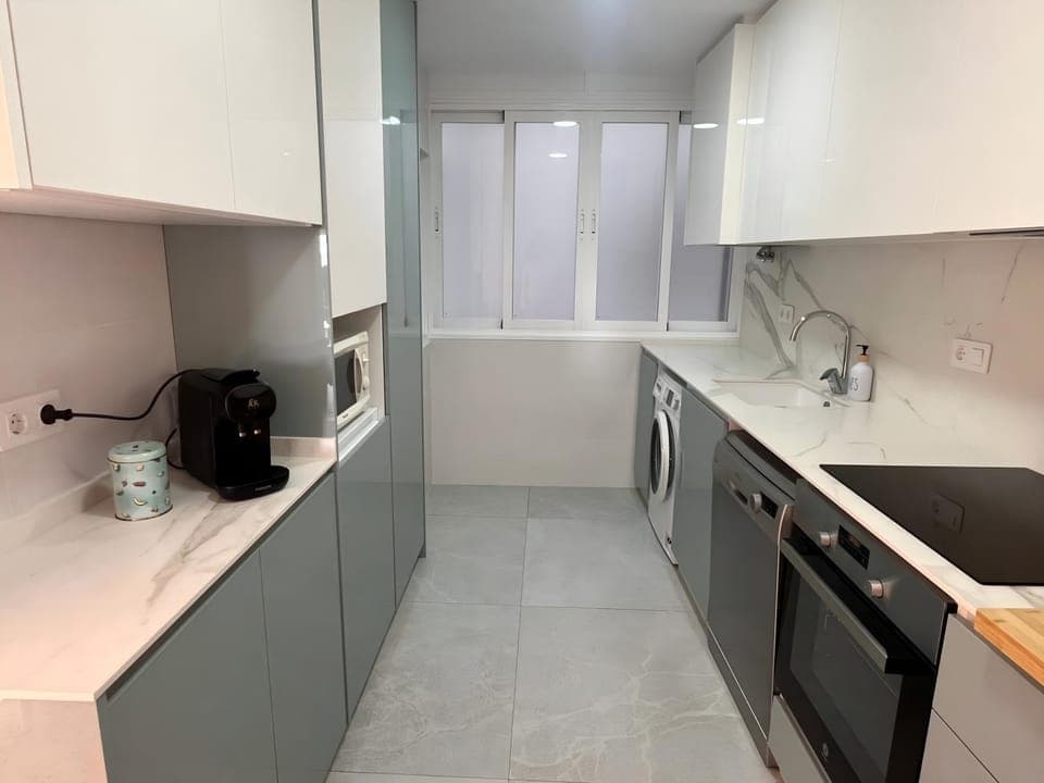 Kitchen or kitchenette, dishwasher, microwave, oven, stove, washing machine