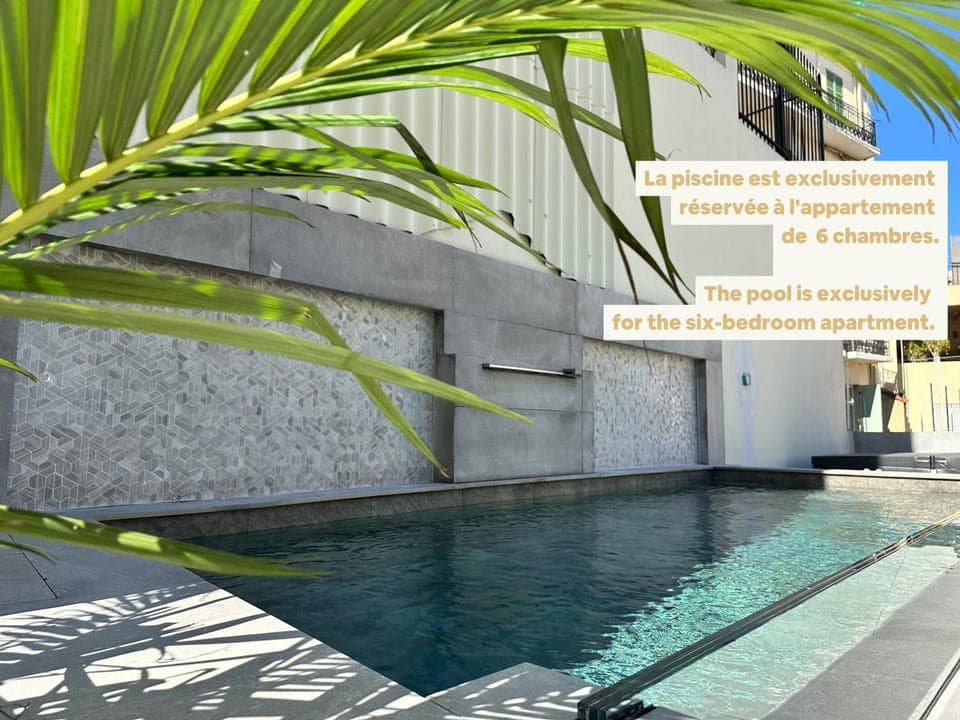 Property building, Day, Text overlay, Pool view, Swimming pool
