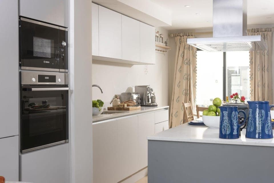 Kitchen or kitchenette, dishwasher, oven, stove, toaster