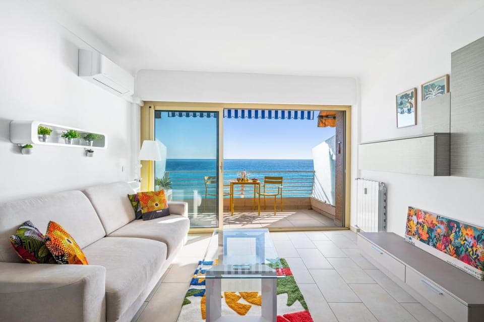 Bed, Natural landscape, View (from property/room), Balcony/Terrace, Living room, Seating area, Dining area, Beach, Bedroom, Sea view