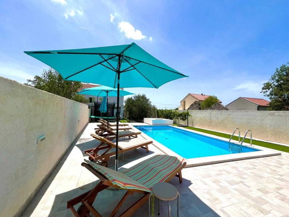 Patio, Day, Pool view, Swimming pool, sunbed