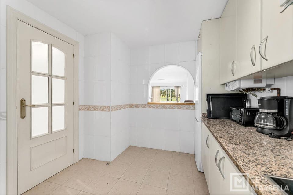 Kitchen or kitchenette, stove, toaster