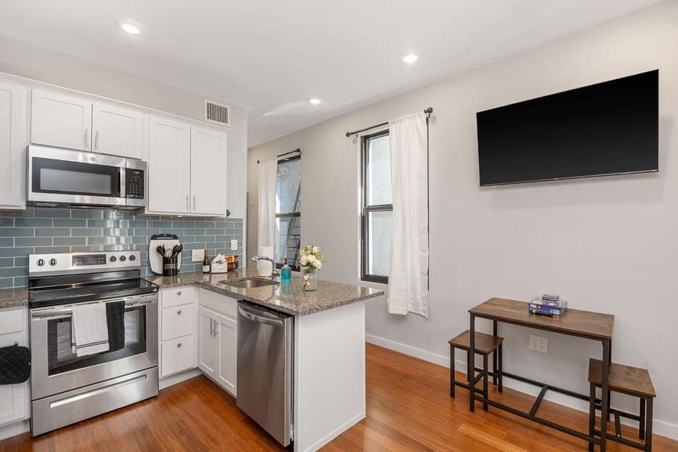 Kitchen or kitchenette, dishwasher, oven, stove, toaster