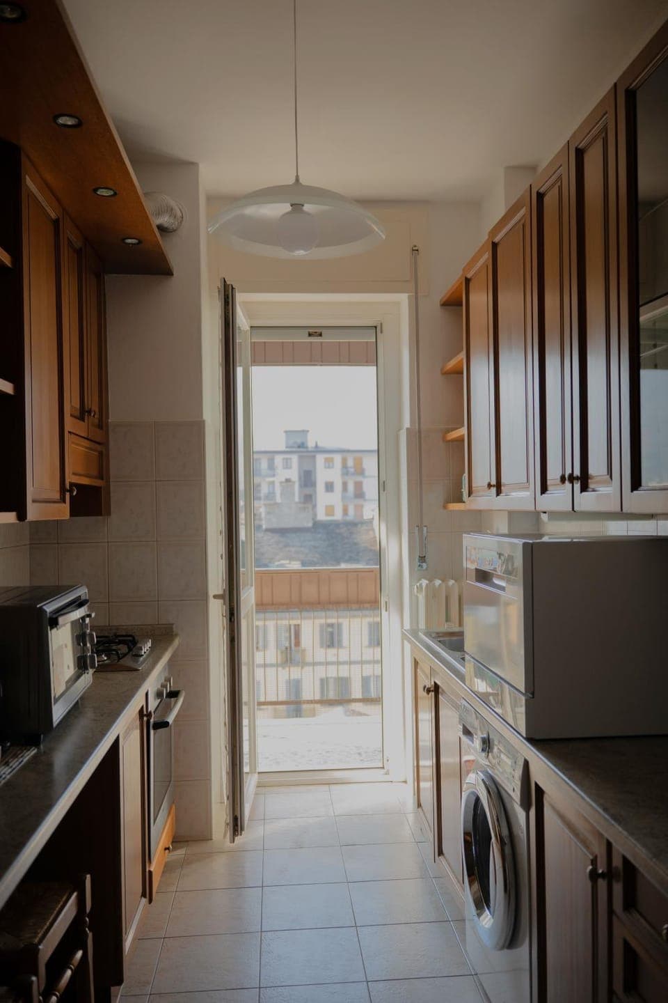 Kitchen or kitchenette, dishwasher, oven, stove, washing machine